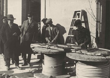 El Escorial. Fire at the power station. Splicers at the power station gate working on the new cable hours after the fire.