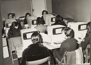 TELEPHONE WORKERS IN A COMPUTER ROOM